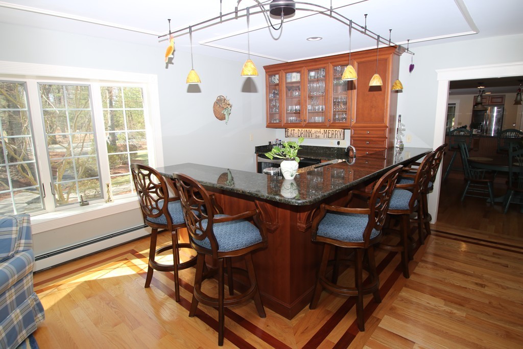 165 Herrick Road Boxford, MA 01921 - Photo 15 of 30 a dining room with furniture a chandelier and wooden floor