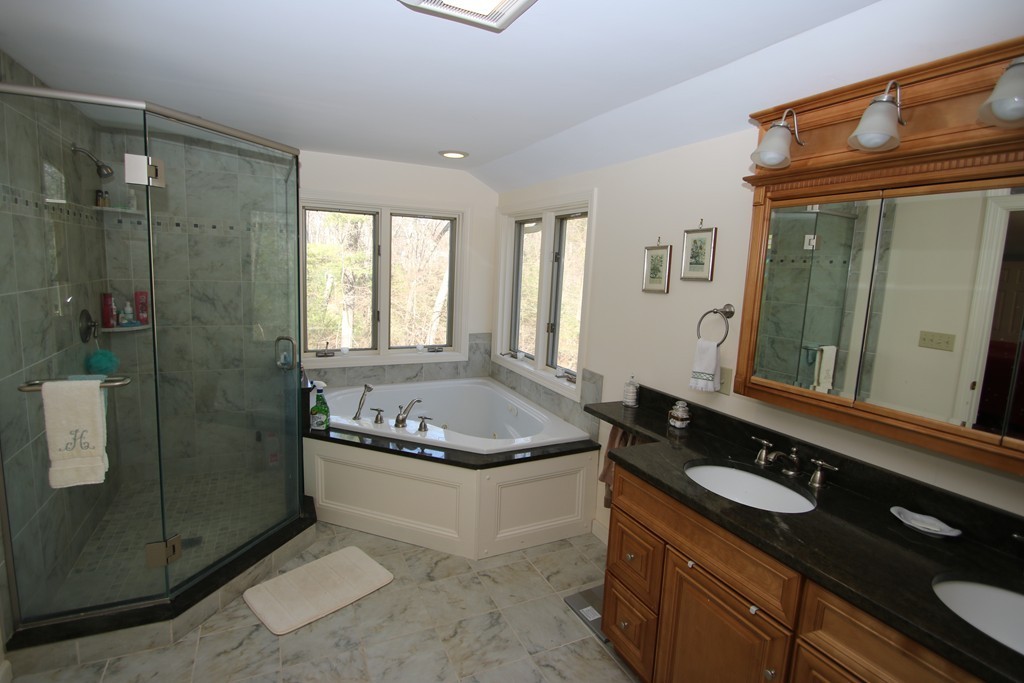 165 Herrick Road Boxford, MA 01921 - Photo 21 of 30 a bathroom with a granite countertop bathtub sink vanity and mirror