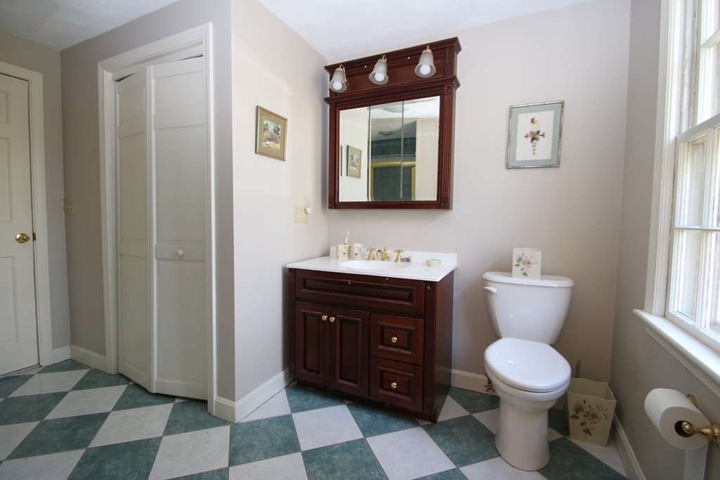 165 Herrick Road Boxford, MA 01921 - Photo 23 of 30 a bathroom with a toilet sink and mirror