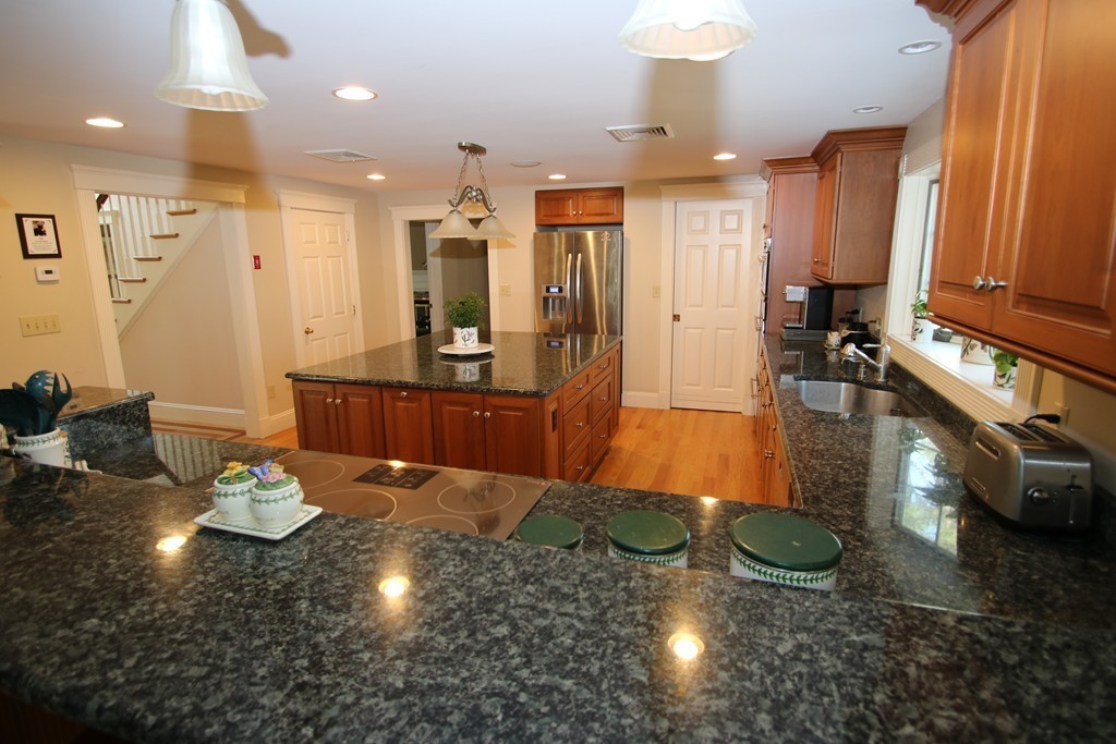 165 Herrick Road Boxford, MA 01921 - Photo 4 of 30 a view of a lobby with dining room and chandelier