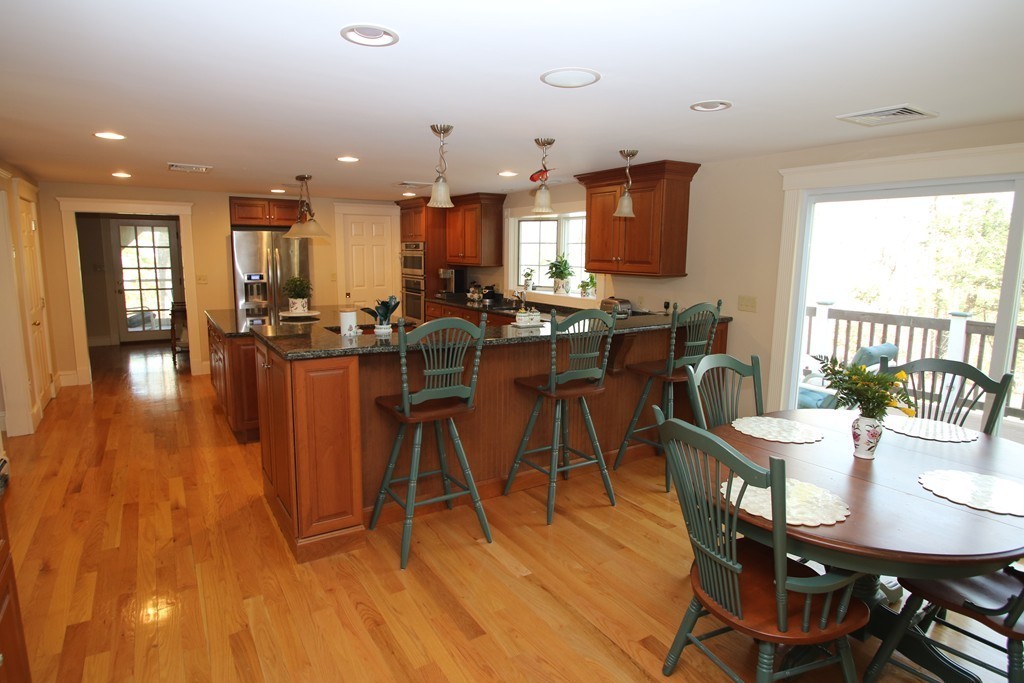 165 Herrick Road Boxford, MA 01921 - Photo 5 of 30 a view of a dining room with furniture and wooden floor