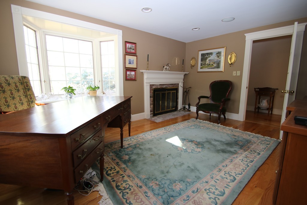 165 Herrick Road Boxford, MA 01921 - Photo 10 of 30 a living room with furniture and a fireplace