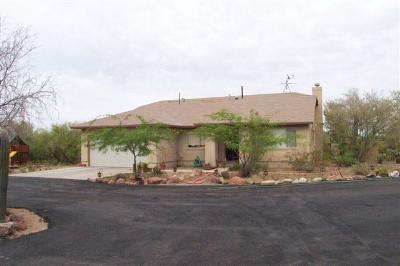 7220 North Artesiano Road Tucson, AZ 85743 - Photo 1 of 8 a view of a house with a yard and sitting area