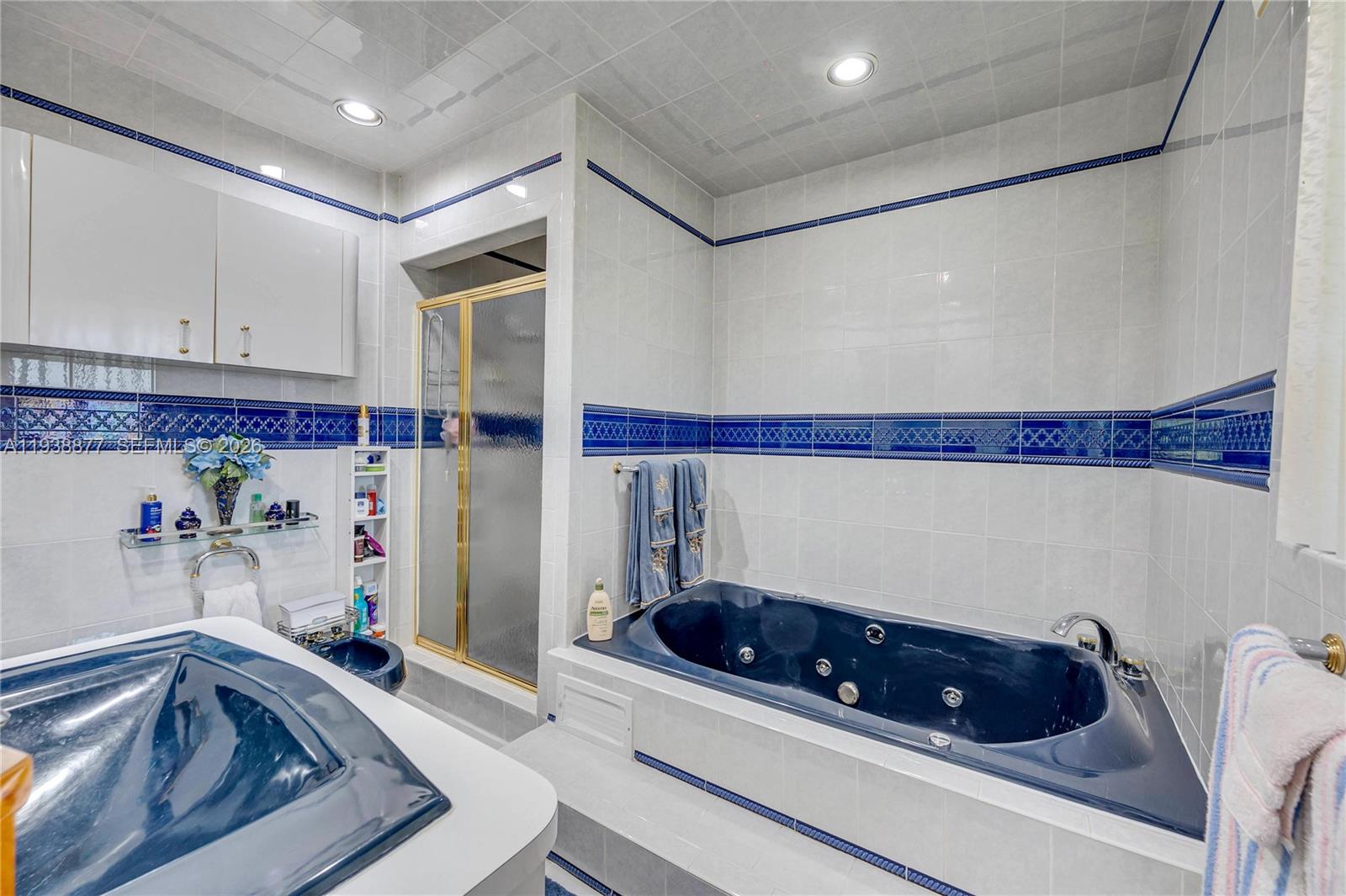 110 Shore Drive West Miami, FL 33133 - Photo 30 of 40 a room with furniture and cabinets