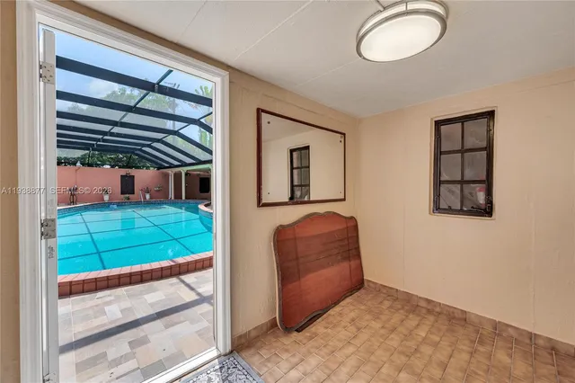a living room with a bed furniture and a window