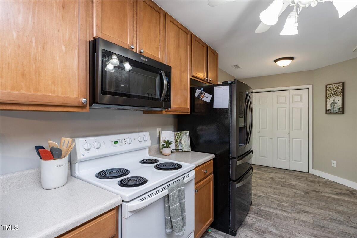 4204 Derry Court Raleigh, NC 27616 - Photo 12 of 30 a kitchen with a stove and a microwave