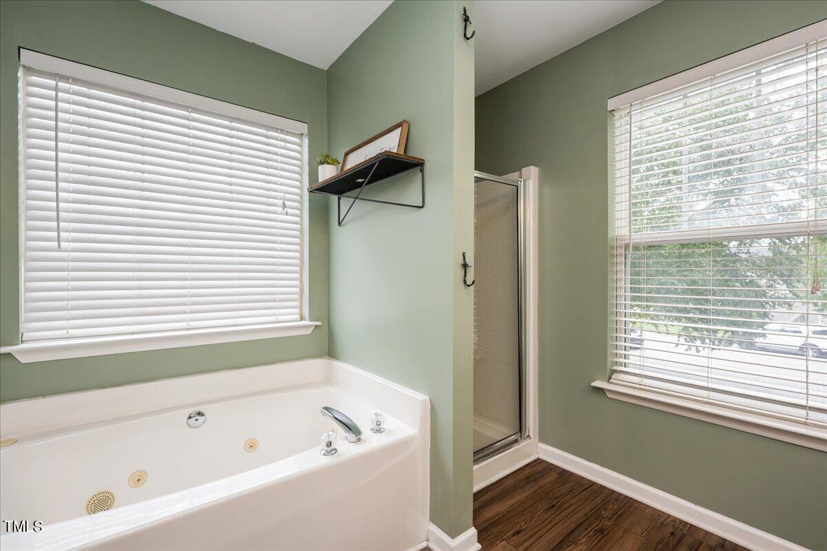 4204 Derry Court Raleigh, NC 27616 - Photo 19 of 30 a bathroom with a bathtub and a shower