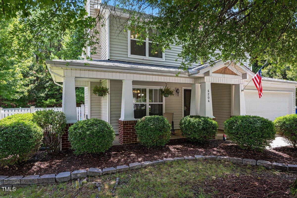 4204 Derry Court Raleigh, NC 27616 - Photo 2 of 30 a front view of a house with garden