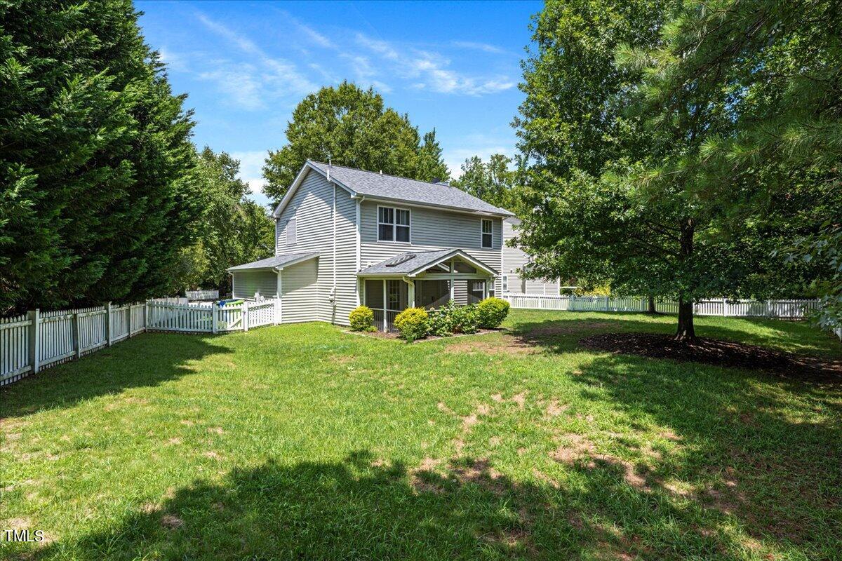 4204 Derry Court Raleigh, NC 27616 - Photo 24 of 30 a view of a house with a big yard and large trees