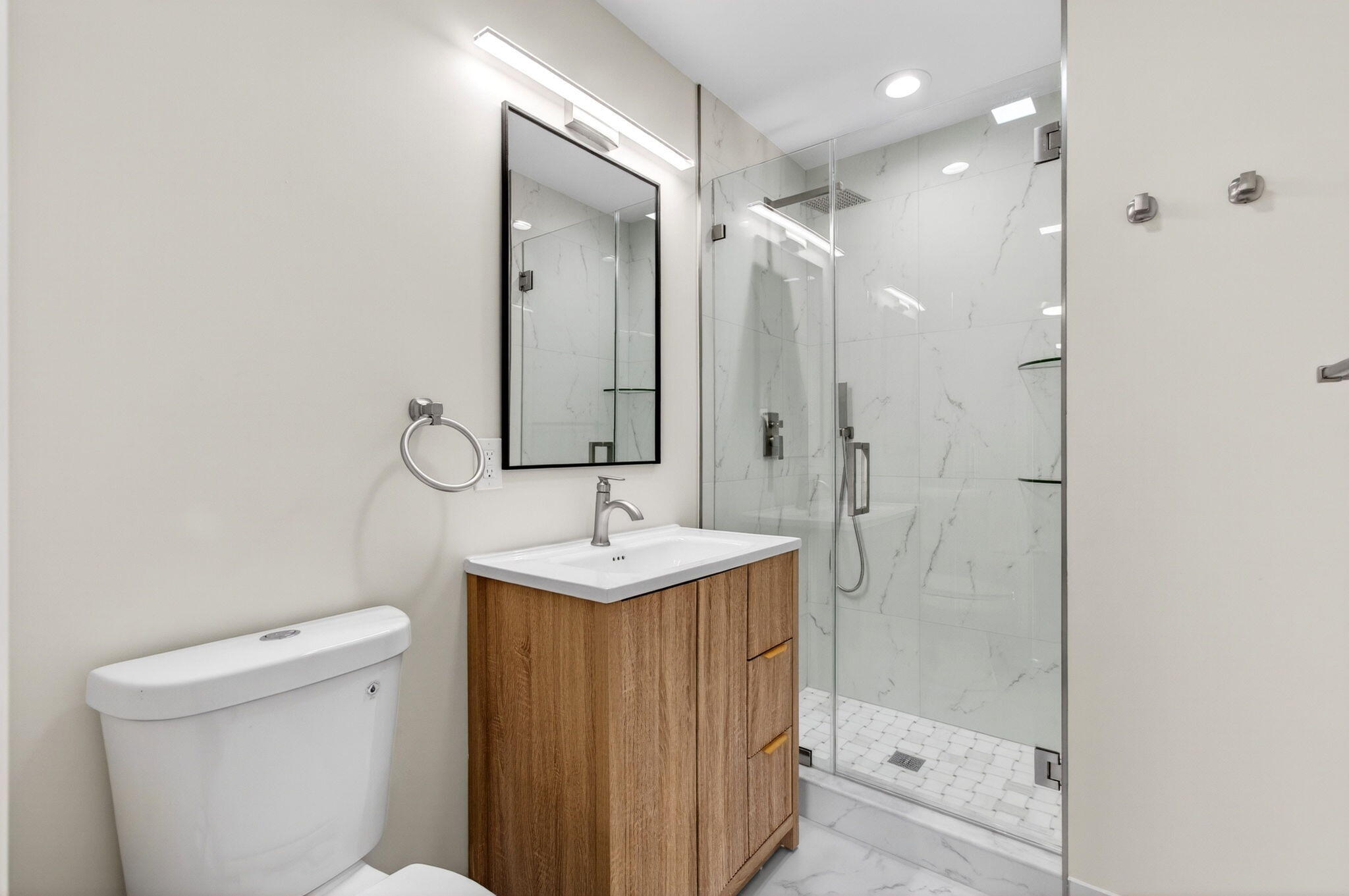 1330 Northwest 13th Street, Unit 12 Boca Raton, FL 33486 - Photo 39 of 52 a bathroom with a sink a toilet and shower