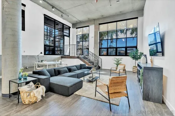 a living room with furniture and a large window