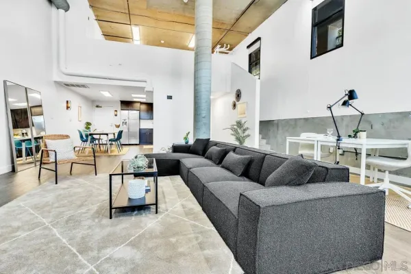 a living room with furniture and a flat screen tv