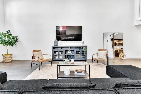 a living room with furniture and a flat screen tv