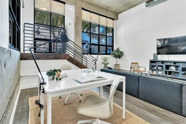 a dining room with furniture and window