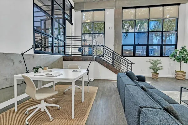 a view of a dining room with furniture window and outside view