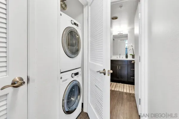a view of a hallway with washer and dryer