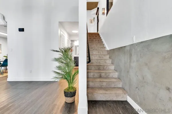 a view of entryway with wooden floor
