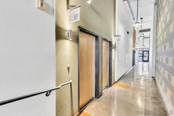 a view of a hallway with a white walls