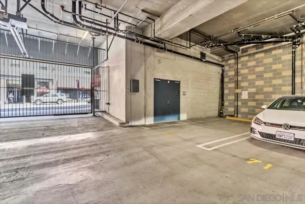 a backyard of a house with barbeque oven table and chairs