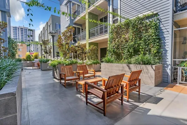 a outdoor dining space with furniture and outdoor view