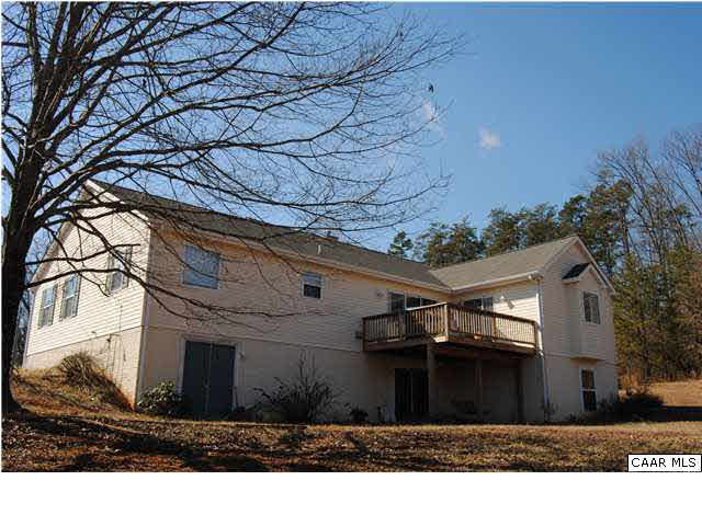 Walk out finished basement with rear deck connecting to living room and master bedroom.