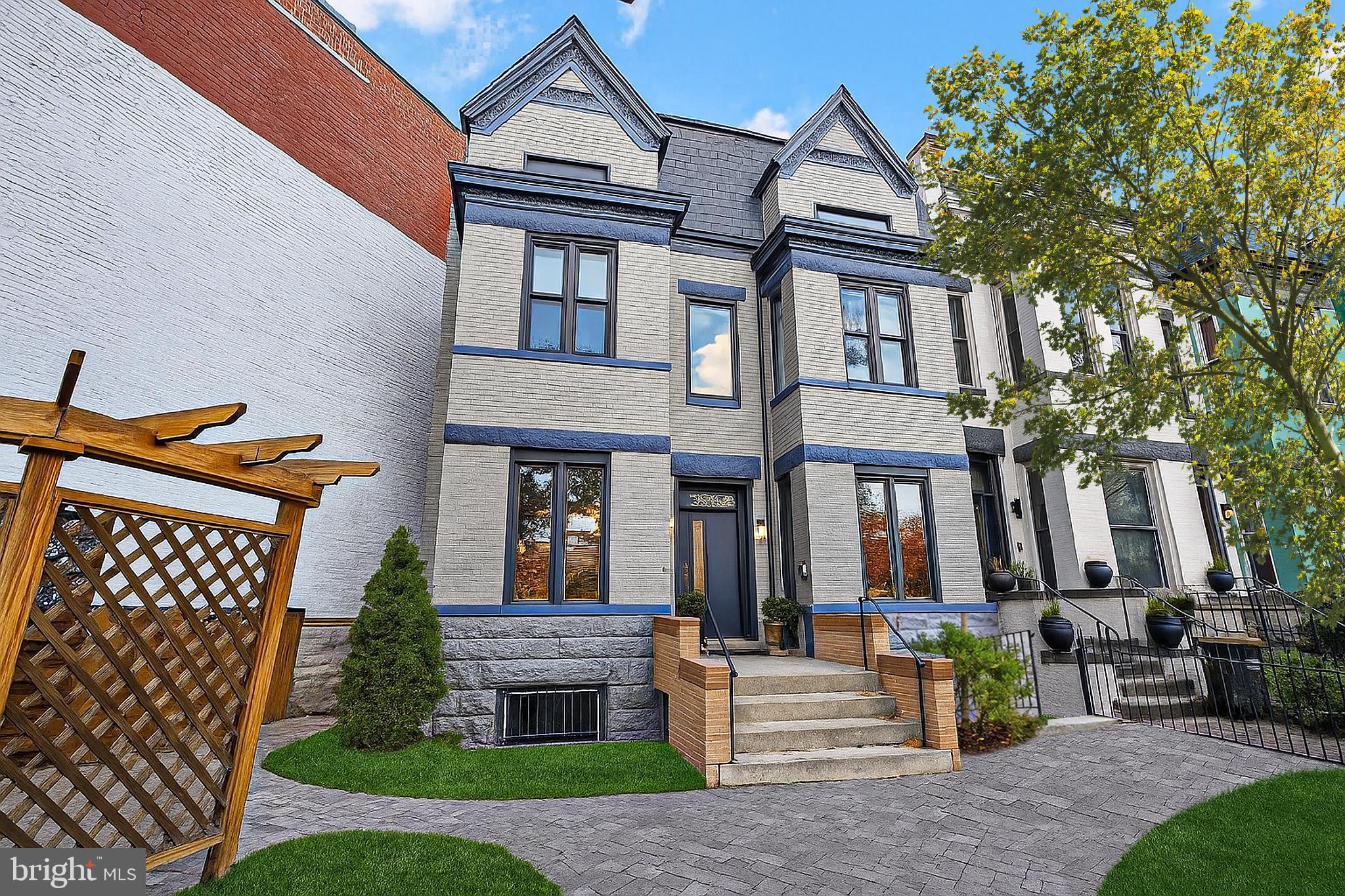a front view of a house with garden