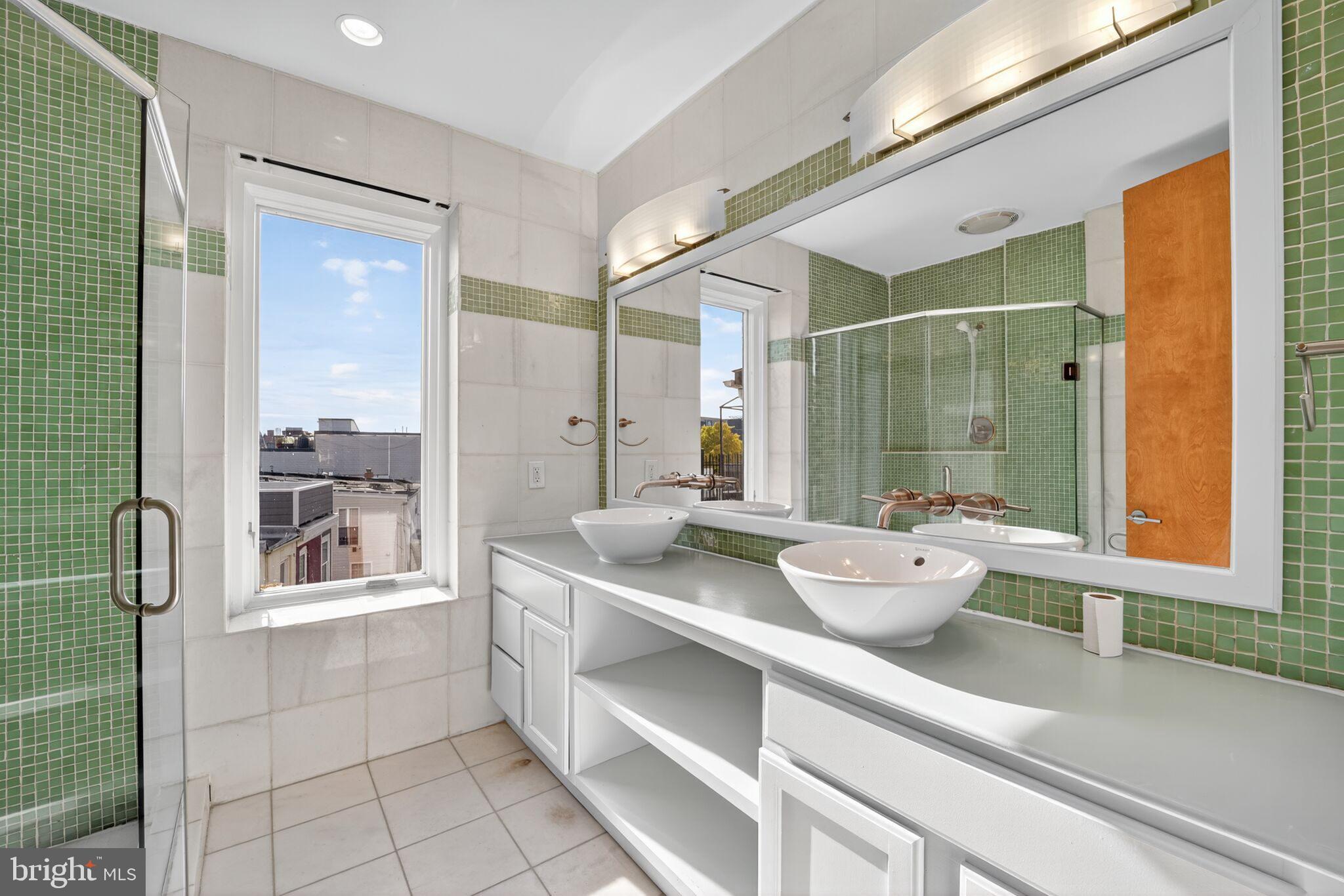1000 Park Road Northwest Washington, DC 20010 - Photo 15 of 20 a bathroom with a granite countertop sink mirror and double