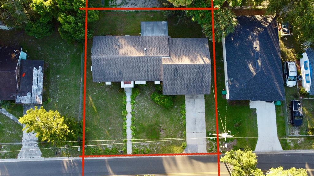 612 Kensington Street Eustis, FL 32726 - Photo 18 of 18 an aerial view of a house having a yard