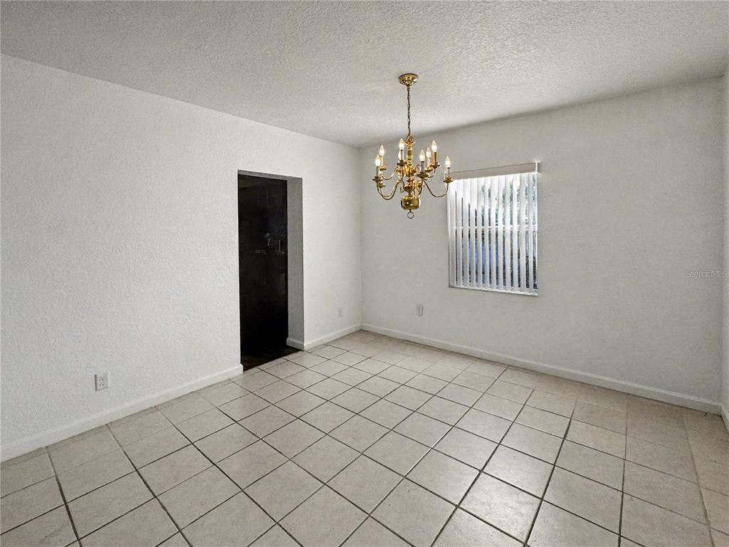 612 Kensington Street Eustis, FL 32726 - Photo 4 of 18 a view of an empty room and window