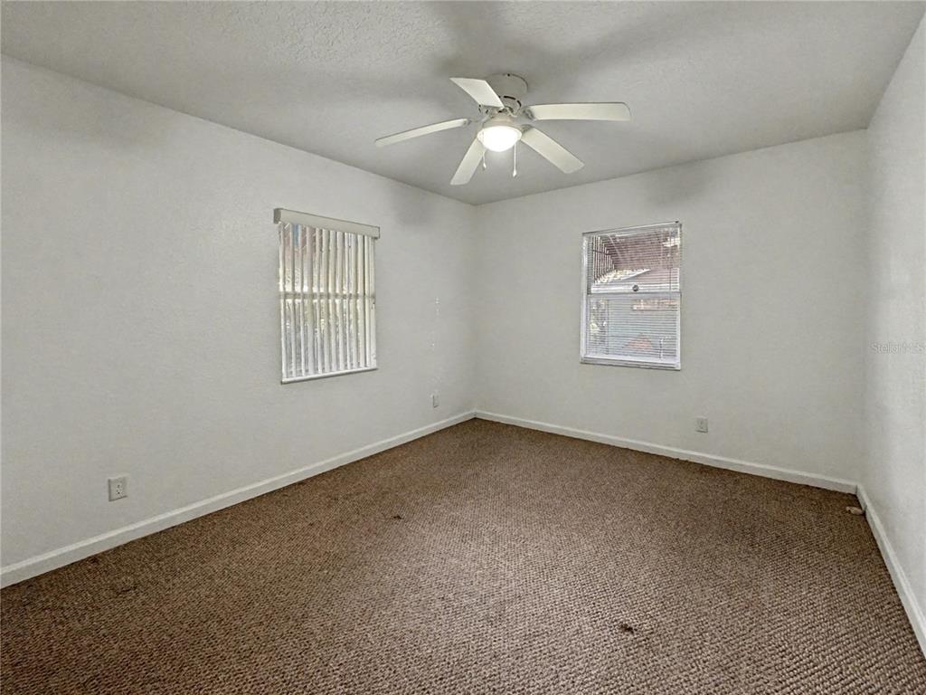 612 Kensington Street Eustis, FL 32726 - Photo 9 of 18 a view of an empty room with a window
