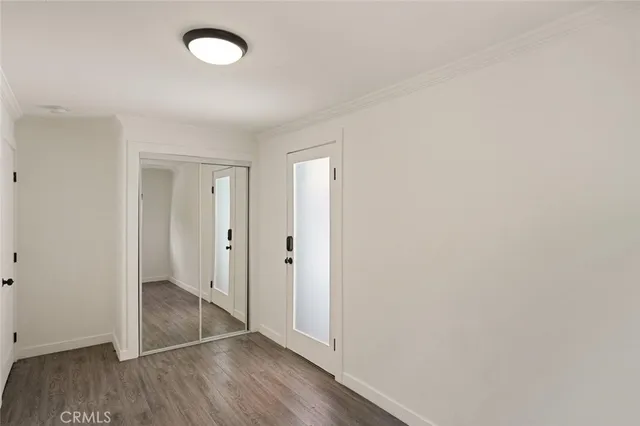 a view of an empty room and wooden floor