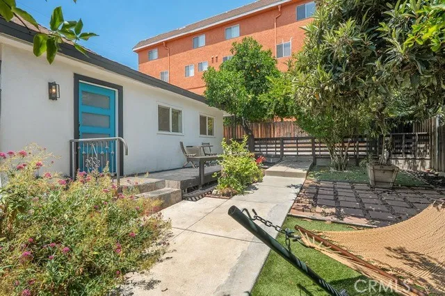 a view of a backyard with potted plants