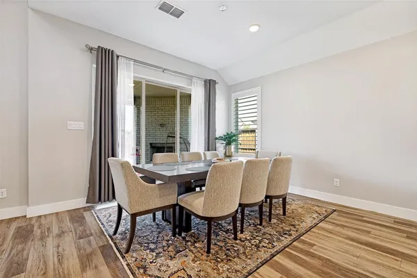 a open kitchen with a sink and breakfast area