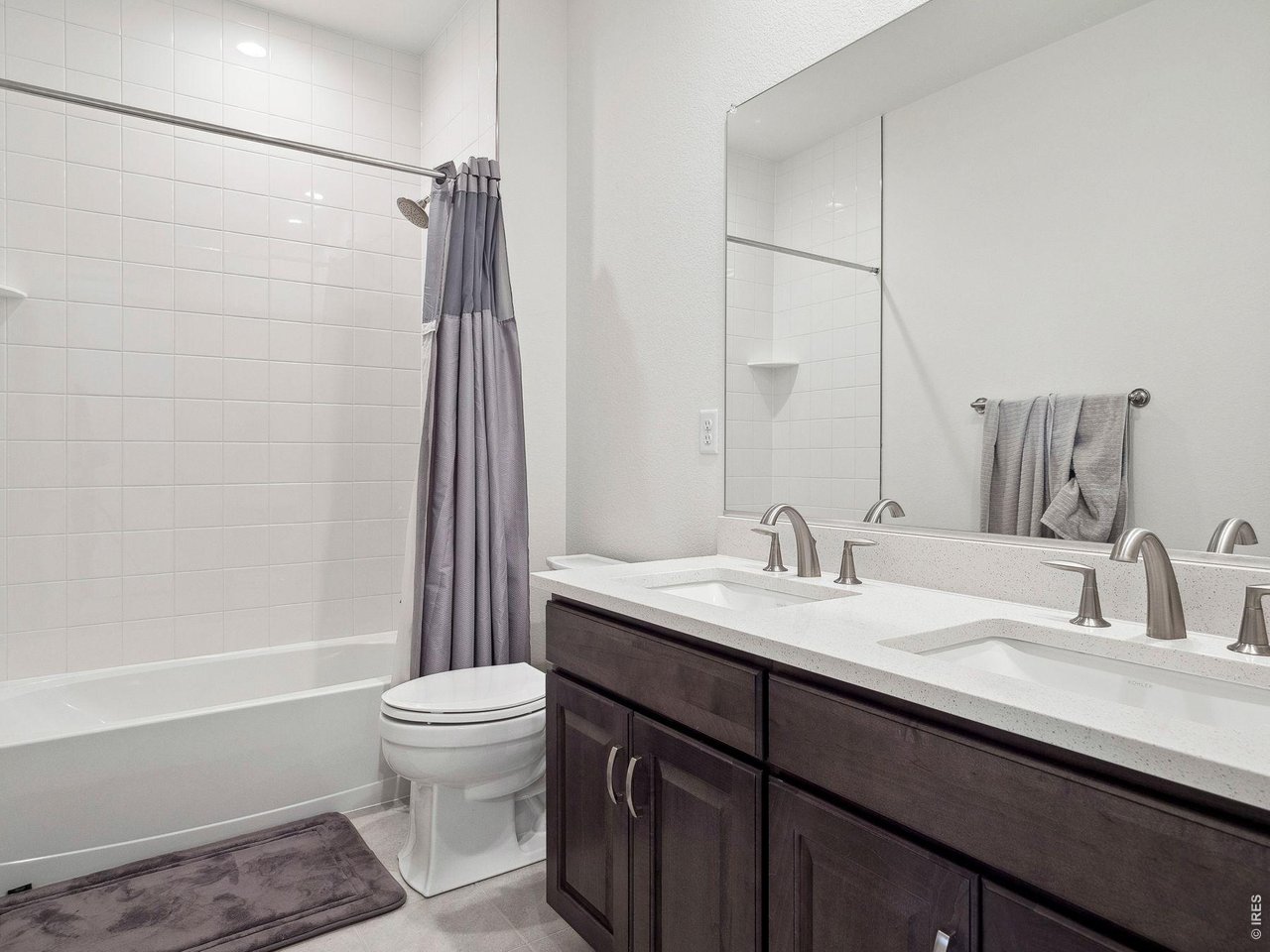 3051 Newfound Lk Road Berthoud, CO 80513 - Photo 29 of 36 a bathroom with a sink a toilet and shower