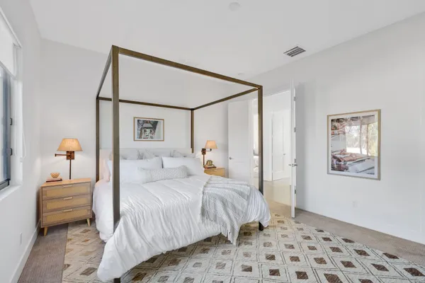 a large bathroom with a tub a sink and mirror