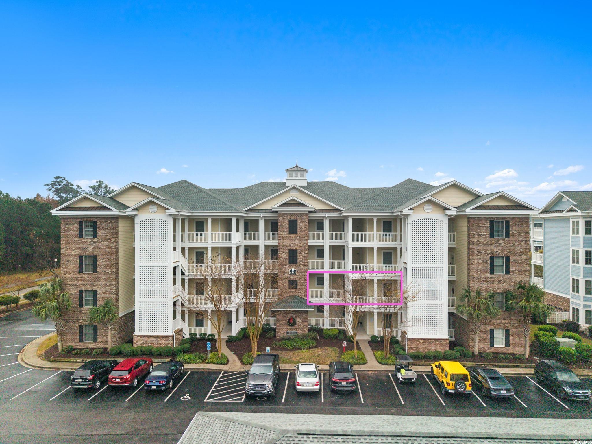 4843 Luster Leaf Circle, Unit 204 Myrtle Beach, SC 29577 - Photo 2 of 36 View of apartment building / complex with uncovered parking