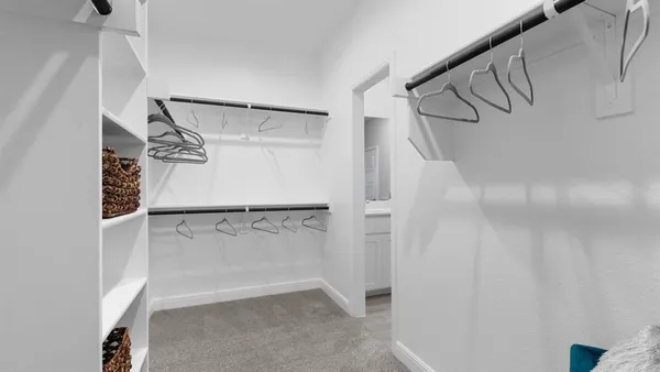 a bathroom with double sink and a mirror