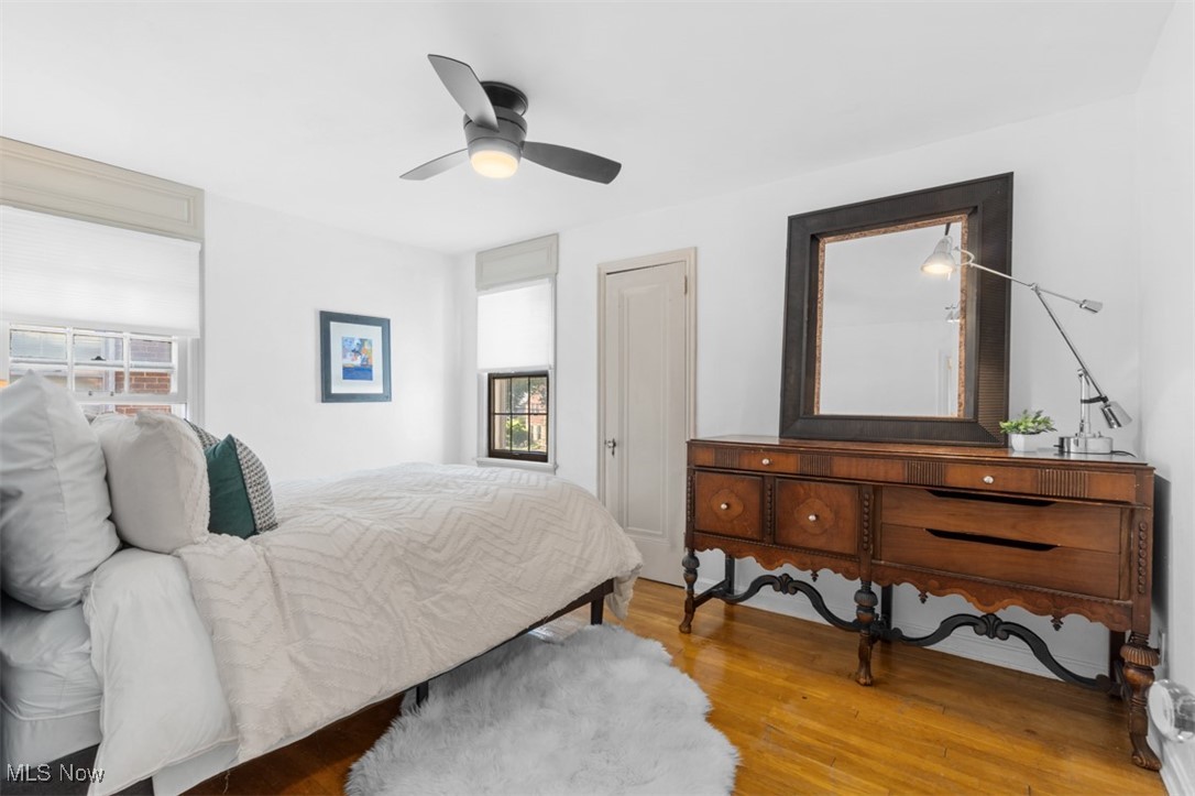 3609 Northcliffe Road University Heights, OH 44118 - Photo 19 of 26 Bedroom featuring multiple windows, wood finished floors, and a ceiling fan