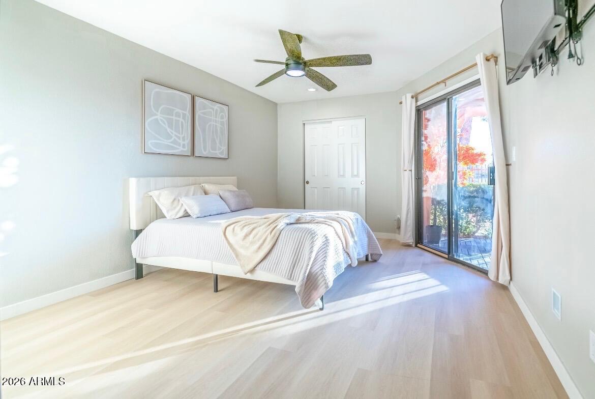 4303 East Cactus Road, Unit 128 Phoenix, AZ 85032 - Photo 10 of 39 a bedroom with a large bed and a window
