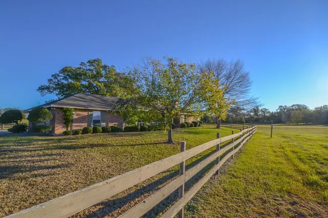 a view of a yard with an outdoor space
