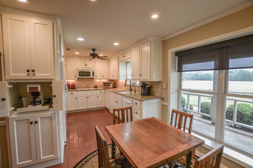 13612 County Road 3900 Athens, TX 75752 - Photo 15 of 40 a view of kitchen with cabinets and wooden floor