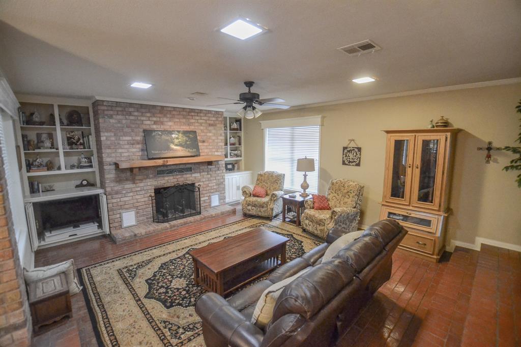 13612 County Road 3900 Athens, TX 75752 - Photo 18 of 40 a living room with furniture and a fireplace
