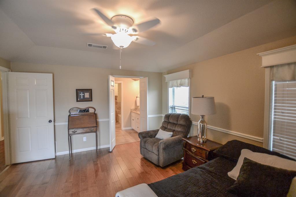 13612 County Road 3900 Athens, TX 75752 - Photo 23 of 40 a living room with furniture and wooden floor