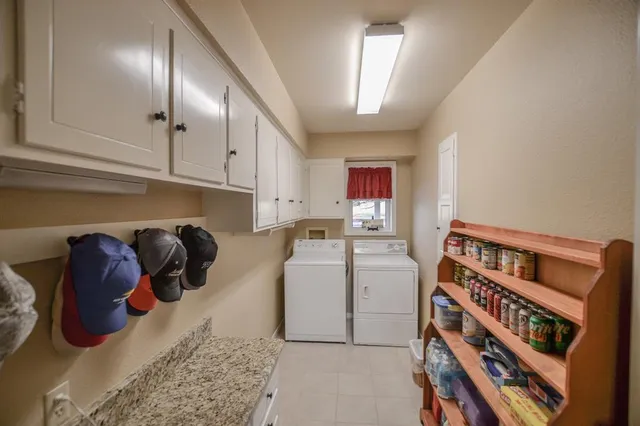a bathroom with a granite countertop sink toilet and mirror