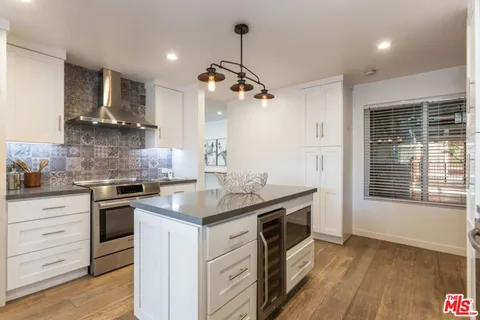 a kitchen with a stove and a sink