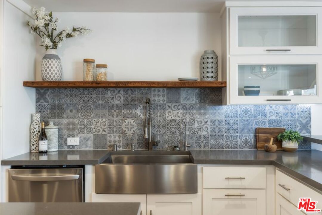 4300 Vía Dolce, Unit 102 Marina del Rey, CA 90292 - Photo 16 of 39 a kitchen with a sink and cabinets