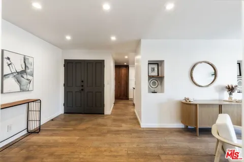 a view of a livingroom with furniture and wooden floor