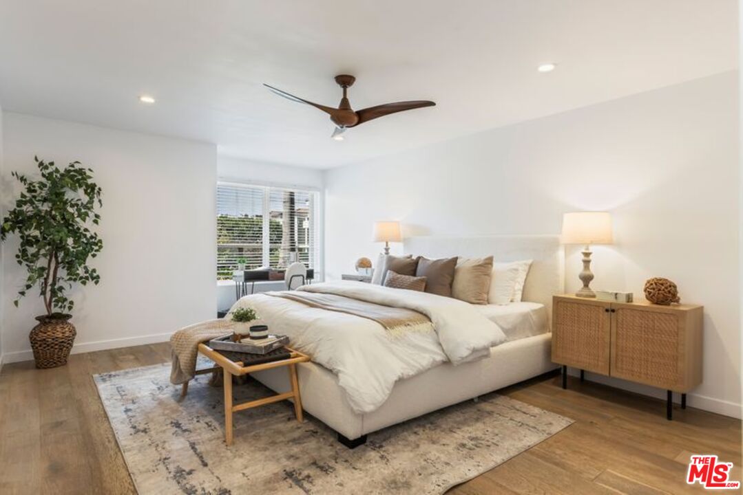 4300 Vía Dolce, Unit 102 Marina del Rey, CA 90292 - Photo 22 of 39 a bedroom with a bed and a potted plant