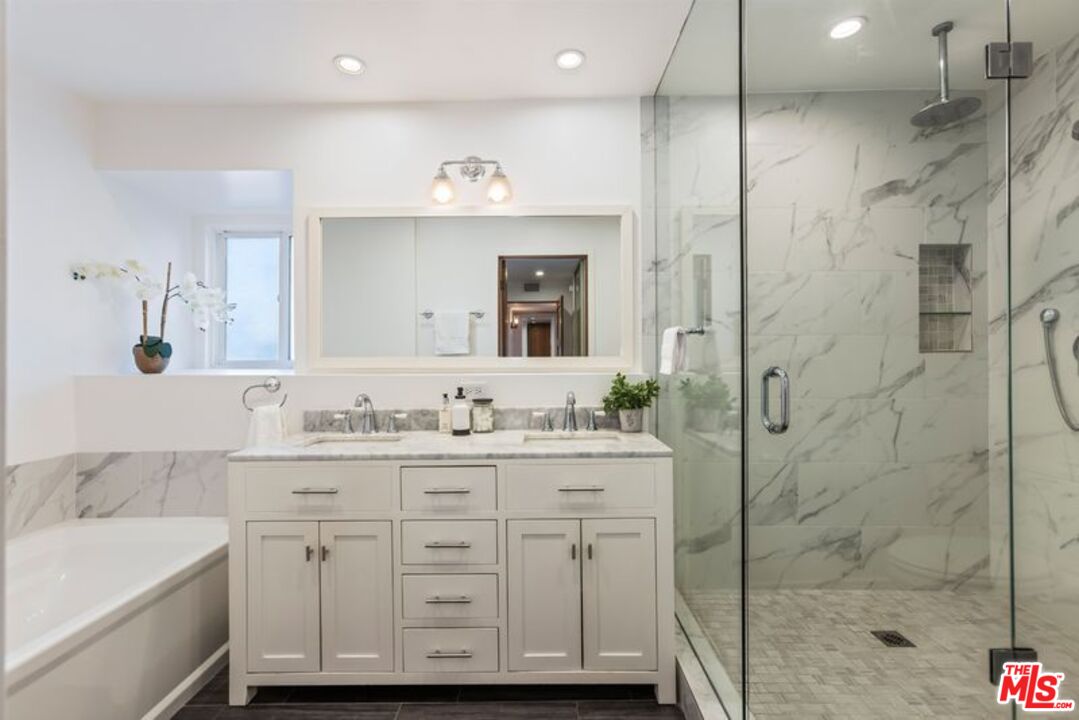 4300 Vía Dolce, Unit 102 Marina del Rey, CA 90292 - Photo 25 of 39 a bathroom with a sink a toilet and shower