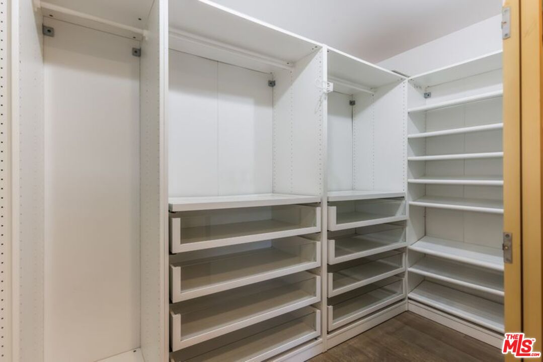 4300 Vía Dolce, Unit 102 Marina del Rey, CA 90292 - Photo 28 of 39 a view of walk in closet with empty racks
